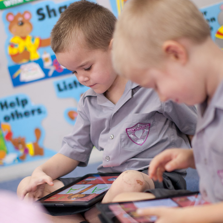 Students using their learning tablet in the classroom in 2012 at Mary Immaculate Primary School Quakers Hill