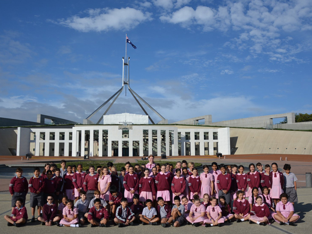 Mary Immaculate Catholic Primary students out front of parliament house, on Canberra excursion