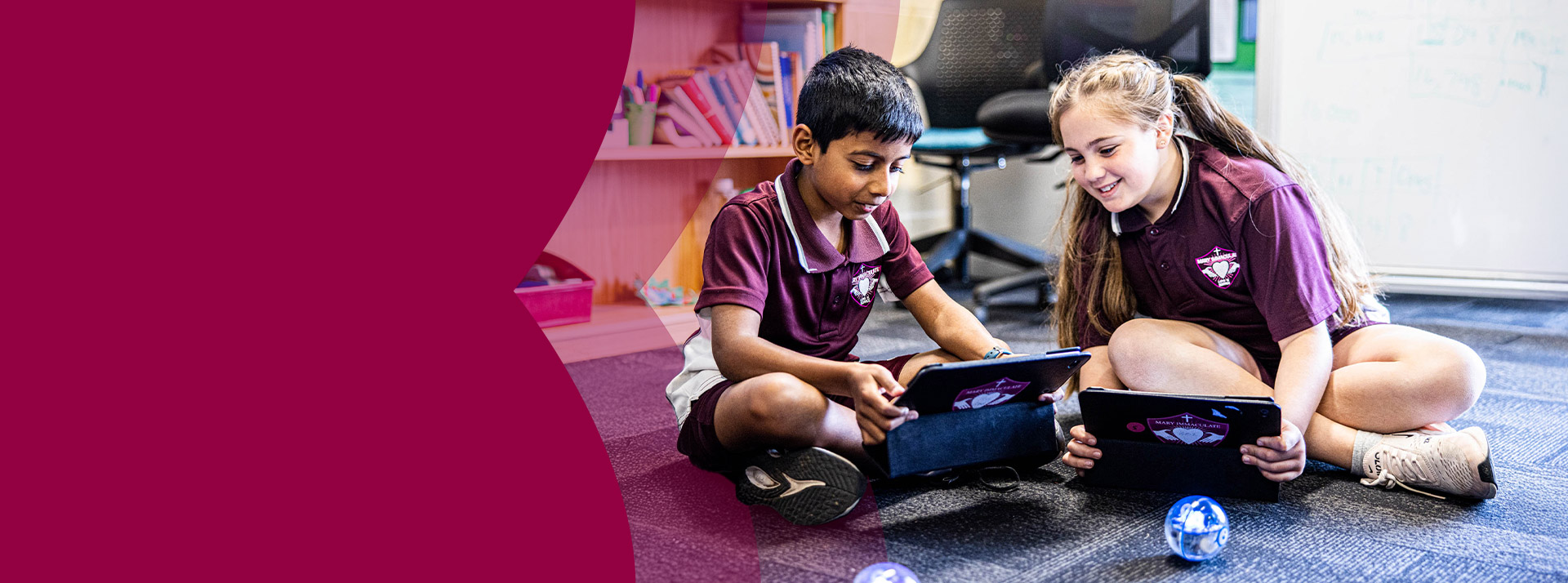 Students programming a ball during an STEM activity in the classroom at Mary Immaculate Primary School Quakers Hill