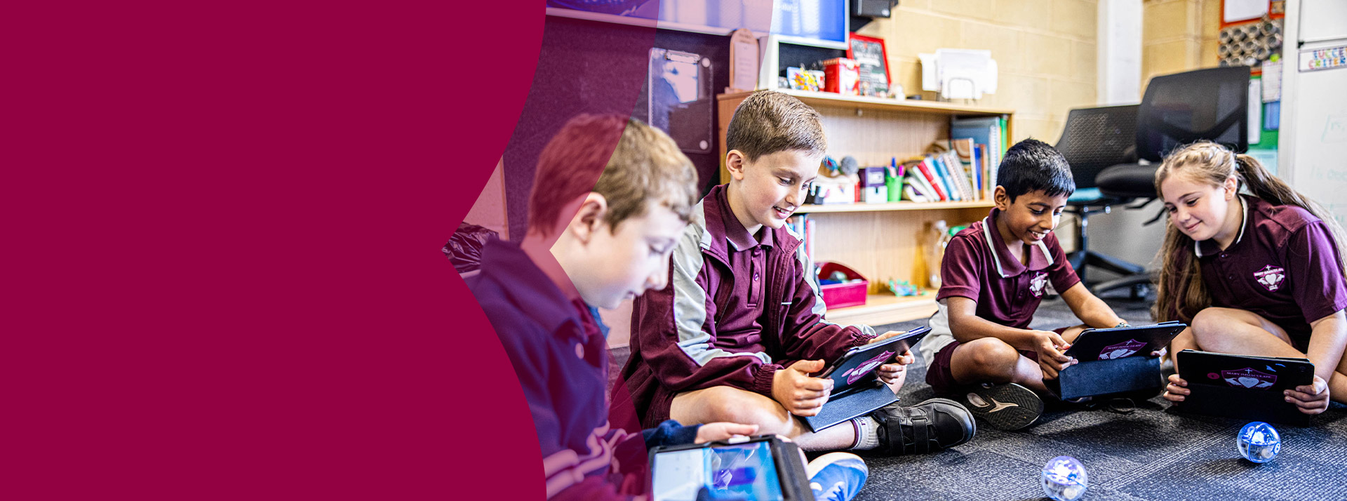 Students programming robotic balls in the classroom at Mary Immaculate Primary School Quakers Hill