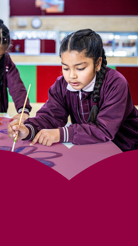Students painting together in the classroom at Mary Immaculate Primary School Quakers Hill