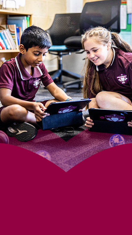 Students programming a ball during an STEM activity in the classroom at Mary Immaculate Primary School Quakers Hill