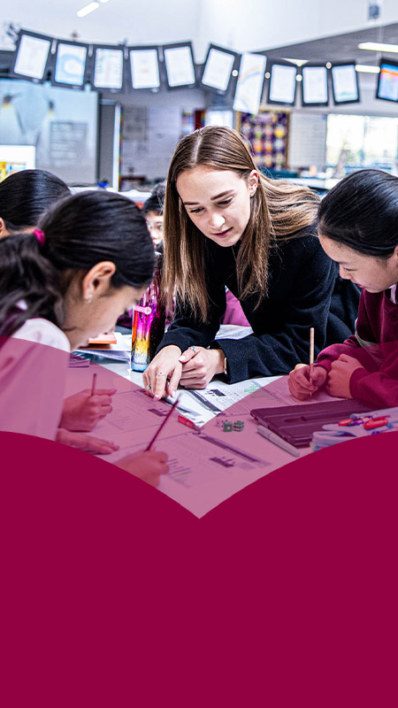 Teacher with her students in the classroom at Mary Immaculate Primary School Quakers Hill