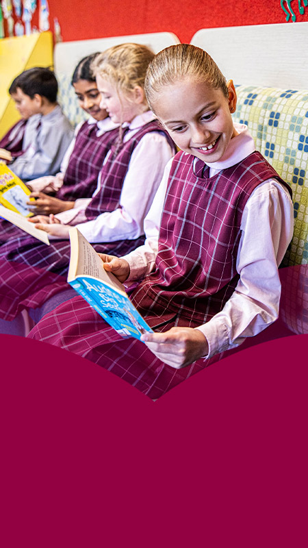 Students reading books in the library at Mary Immaculate Primary School Quakers Hill