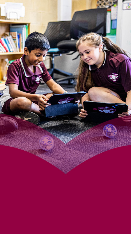 Students programming robotic balls in the classroom at Mary Immaculate Primary School Quakers Hill