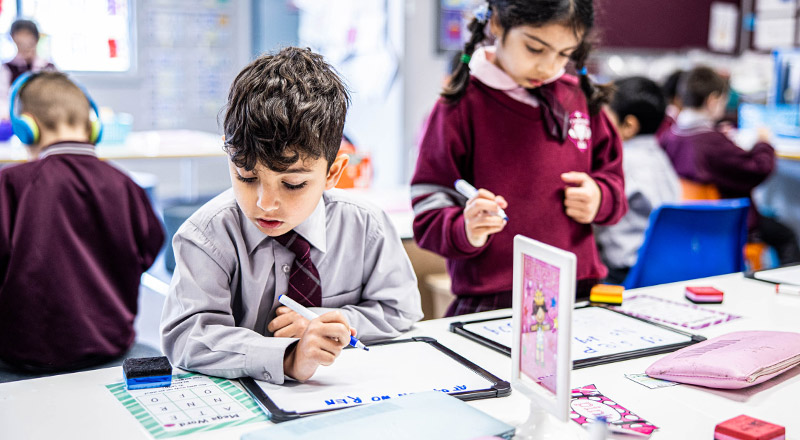 Student practising his writing skills at Mary Immaculate Primary School Quakers Hill