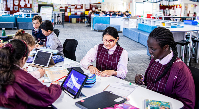 Students studying together in the classroom at Mary Immaculate Primary School Quakers Hill