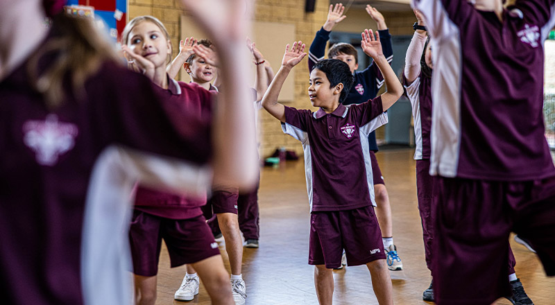 Students dancing in the multi purpose area at Mary Immaculate Primary School Quakers Hill