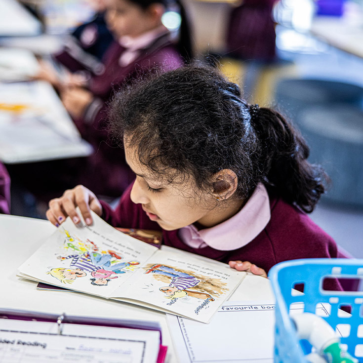Student reading in the classroom at Mary Immaculate Primary School Quakers Hill