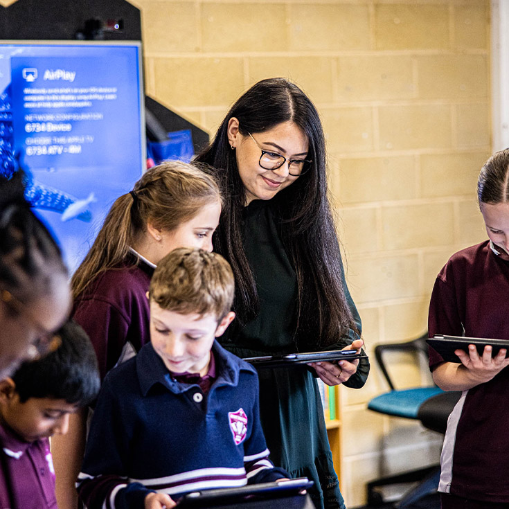Students with her students in the classroom at Mary Immaculate Primary School Quakers Hill