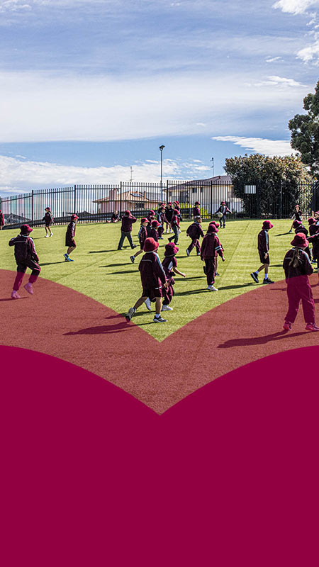 Mary Immaculate Primary Quakers Hill students playing on outdoor astroturfed sports field